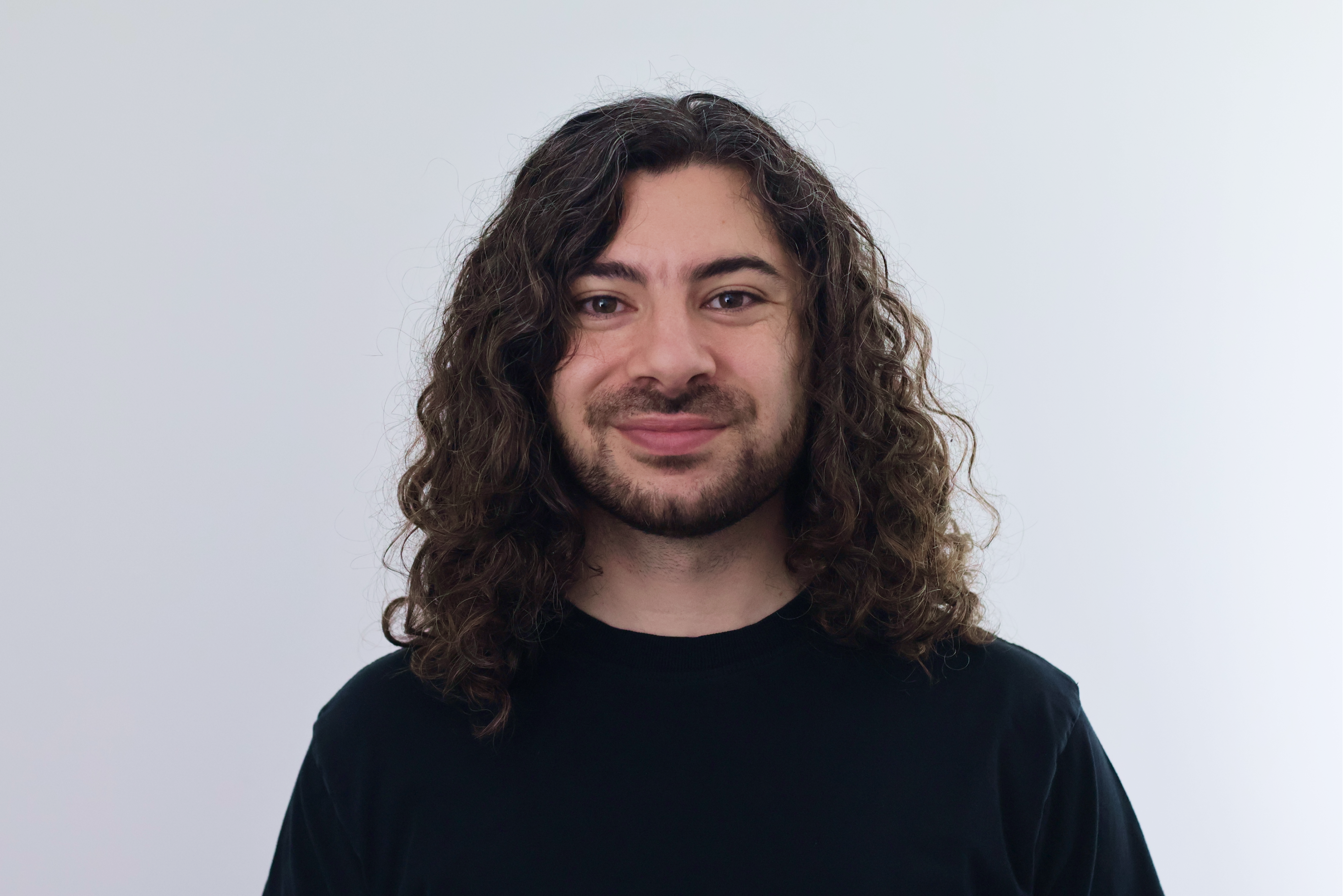 Adam C Younis Headshot Glasses